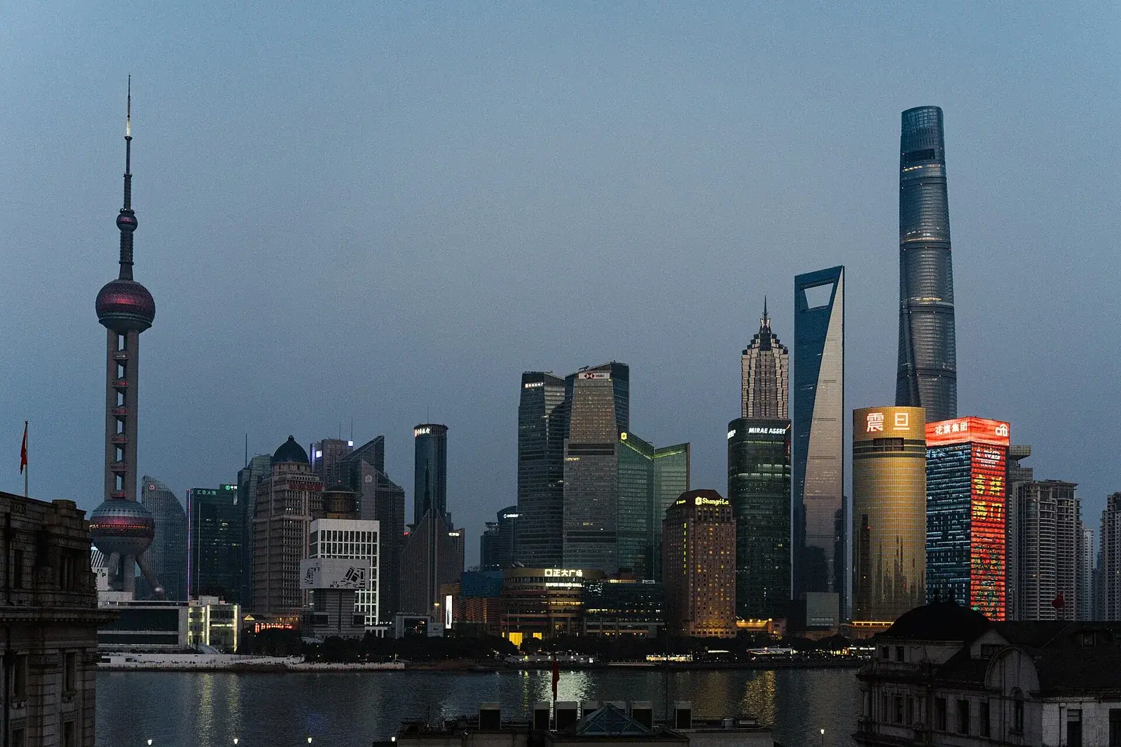 Archive: Pudong skyline in Shanghai, 10 February 2024. Economic context, not a photograph of the October 2026 data release.