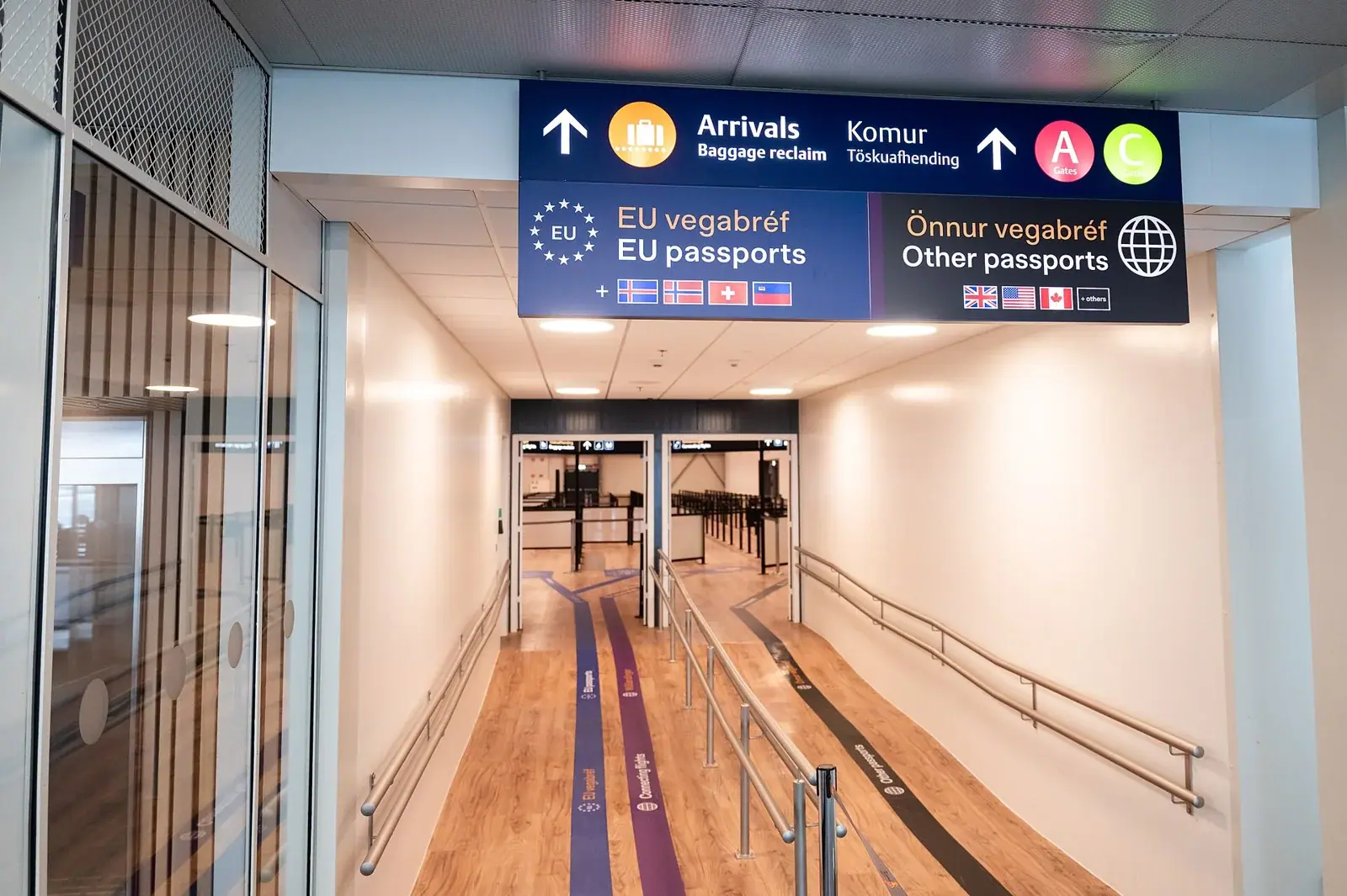 Archive: corridor towards passport control at Keflavík International Airport, 21 August 2026. Not a photograph of the reported EES queues.