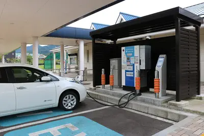 Archive: electric-vehicle charging station at Johana service area, Japan, 4 September 2017. Industry context; not a Foxconn or Mitsubishi Electric installation or a photograph of the agreement.