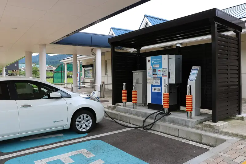 Archive: electric-vehicle charging station at Johana service area, Japan, 4 September 2017. Industry context; not a Foxconn or Mitsubishi Electric installation or a photograph of the agreement.