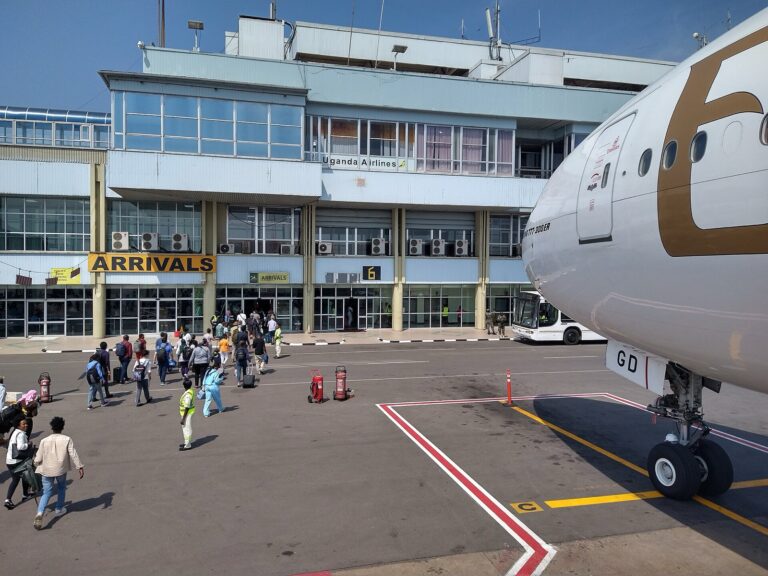 Arrivals at Entebbe International Airport with an Emirates aircraft, 12 August 2023. Illustrative archive; not current health screening or an affected flight.
