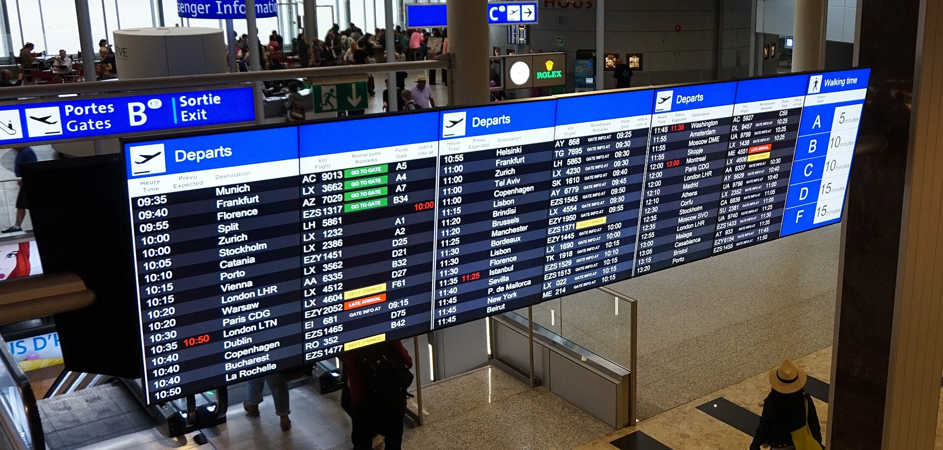 Departure information boards at Geneva Airport in 2015.